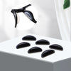 Black silicone nose pads for eyeglasses shown on a white surface with an inset diagram.