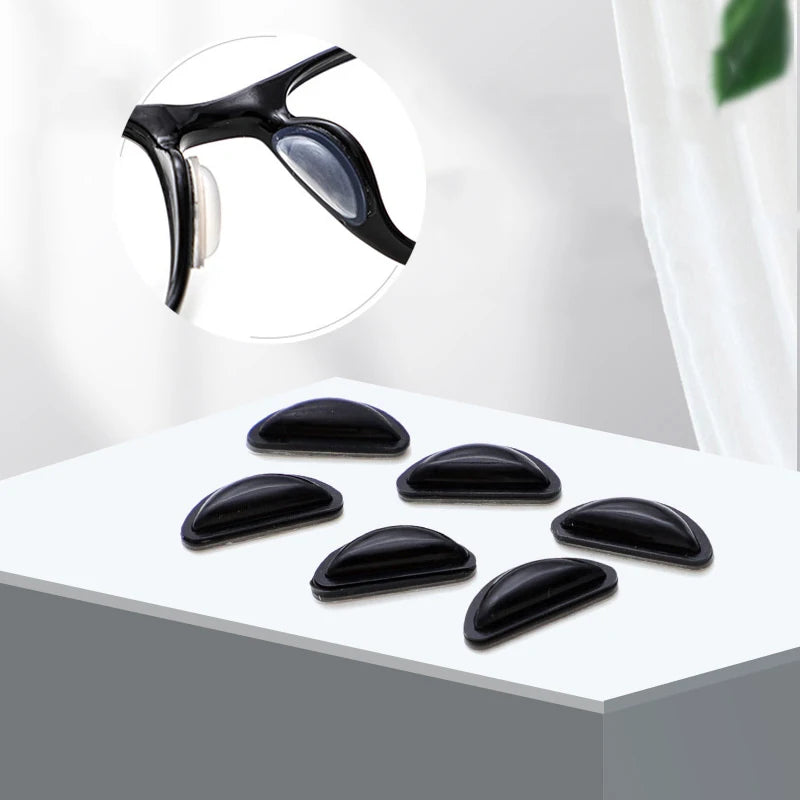 Black silicone nose pads for eyeglasses shown on a white surface with an inset diagram.
