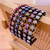 Black elastic hair hoops decorated with colorful sparkling rhinestones and flowers