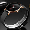 A black men's quartz sport watch with a rose gold case and black strap shown on a dark background.