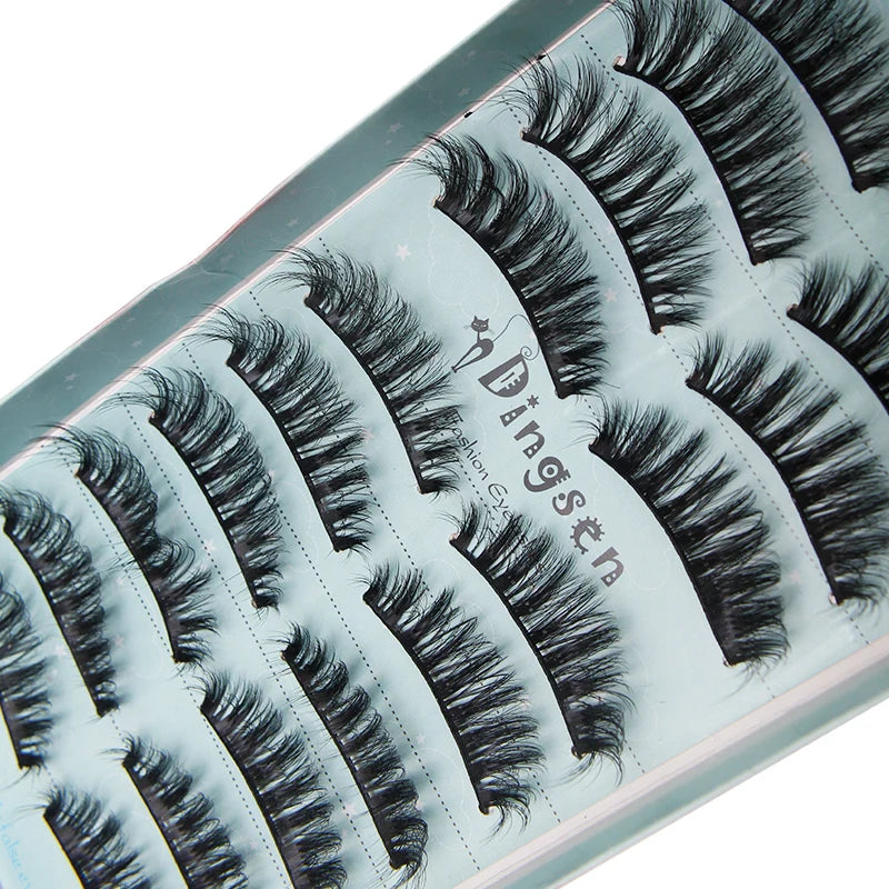 A close-up of a tube of Dangsten fashion eye mink false eyelashes displayed on a light background.