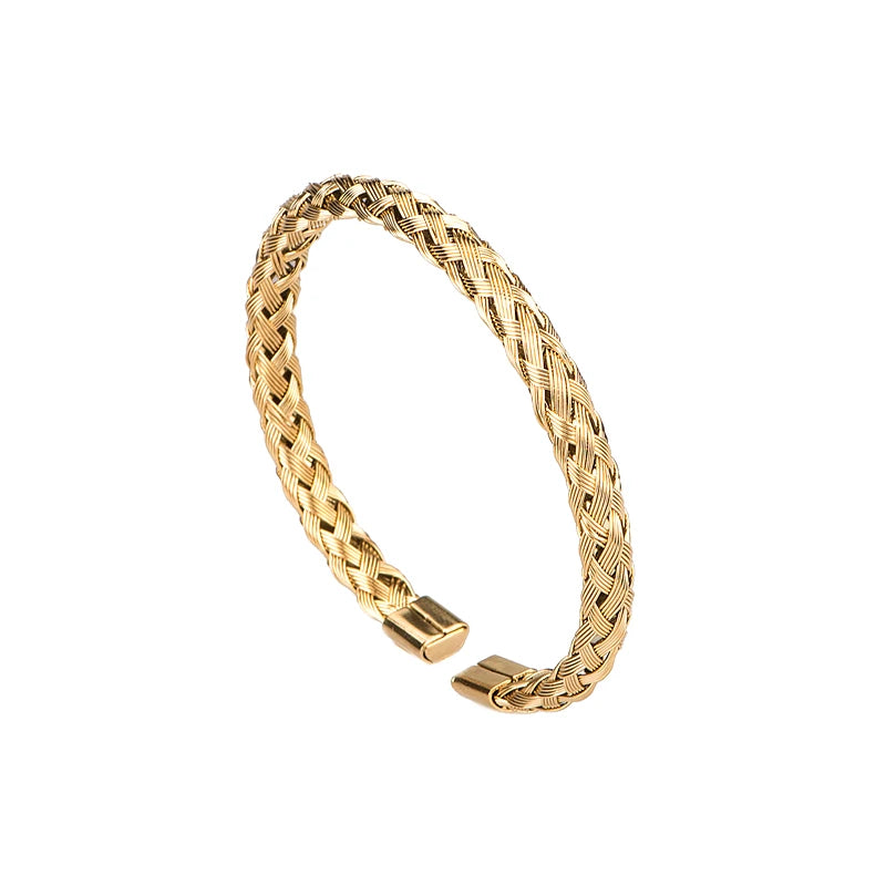 A gold-toned luxury Roman number stainless steel bracelet with a textured braided design.