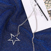 Silver hollow star pendant on a chain attached to a white paper with text