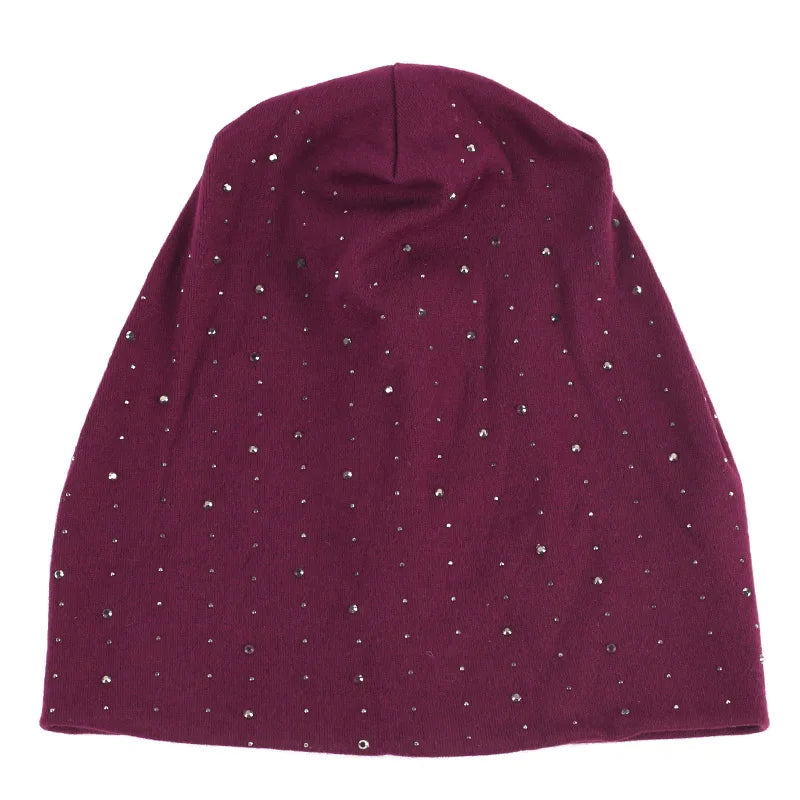 A deep purple rhinestone beanie hat for women.