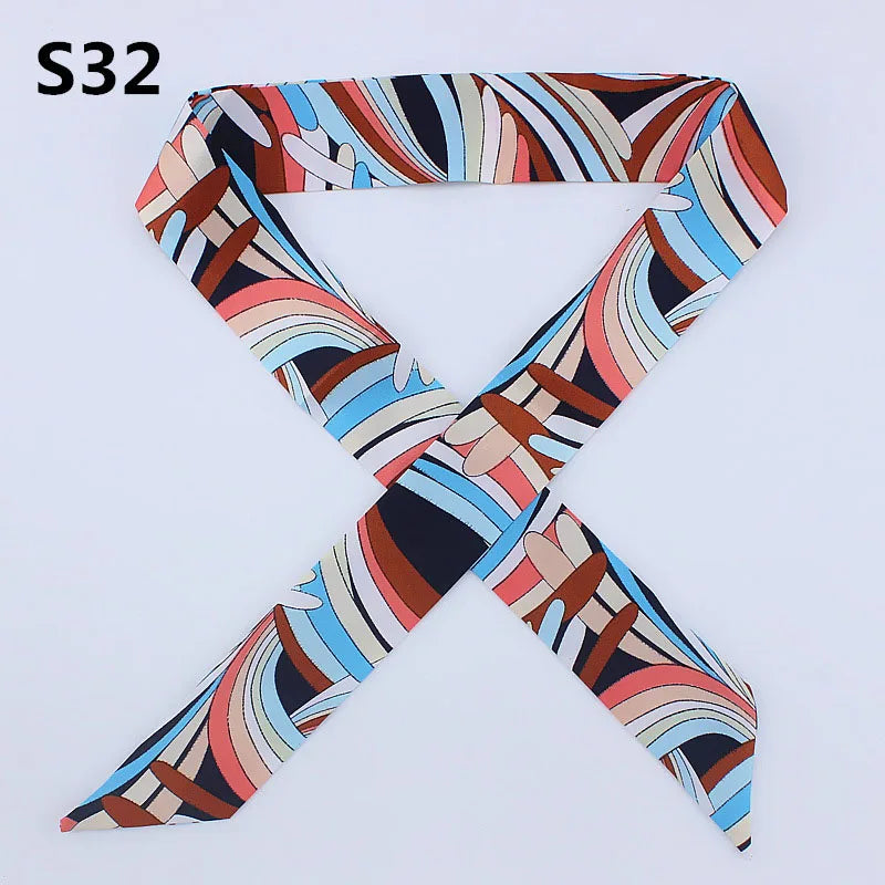 A multi-color leopard print silk headband scarf shown in an 'X' shape.