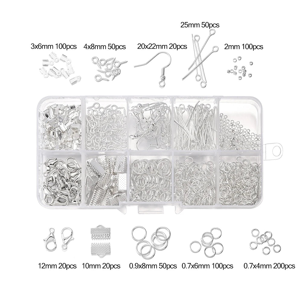 A collection of silver jewelry findings including clasps, hooks, jump rings, and various sized rings and chains.