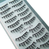 Close-up display of various styles of black mink false eyelashes on a clear background.