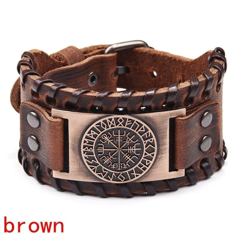 A brown leather bracelet featuring a bronze compass design and a textured strap.