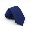 A dark blue men's solid color anti-wrinkle bamboo fiber tie folded neatly.