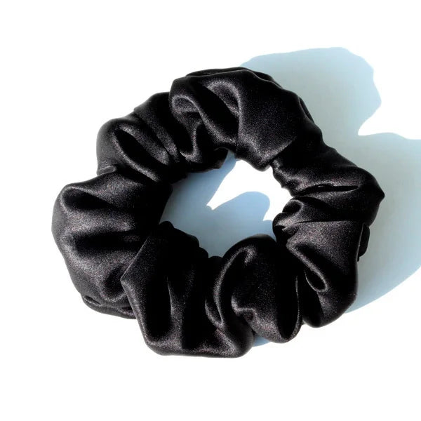 Black satin hair scrunchies tied in a circular, ruffled design.