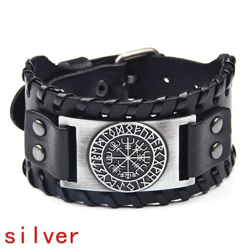 Black leather bracelet with a silver compass design and studs.