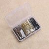 A clear plastic box containing various metal hair clips in gold, silver, and black colors.