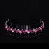 A black rhinestone anti-slip hairband for women decorated with pink and purple stones.