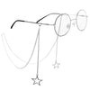 A pair of clear-framed eyeglasses with a delicate chain and star pendant lanyard.