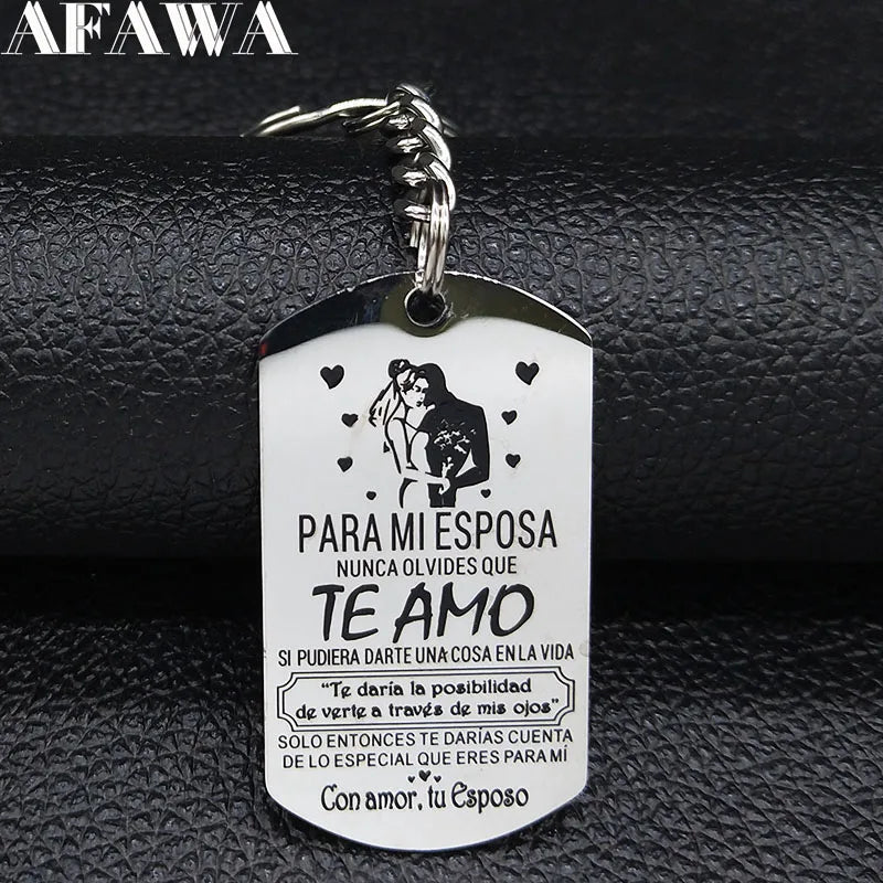 A white stainless steel keychain featuring a silhouette of a couple and Spanish text for a wife.