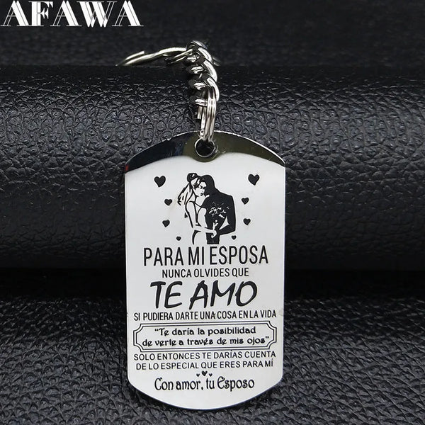 A white stainless steel keychain featuring a silhouette of a couple and Spanish text for a wife.