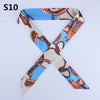 Blue silk headband scarf with a brown leopard print pattern in an 'X' shape
