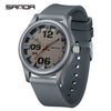 A gray classic quartz fashion watch with a dark dial and silver bezel and silicone strap.