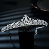 A sparkling cubic zirconia bridal tiara headband displayed on a dark surface.