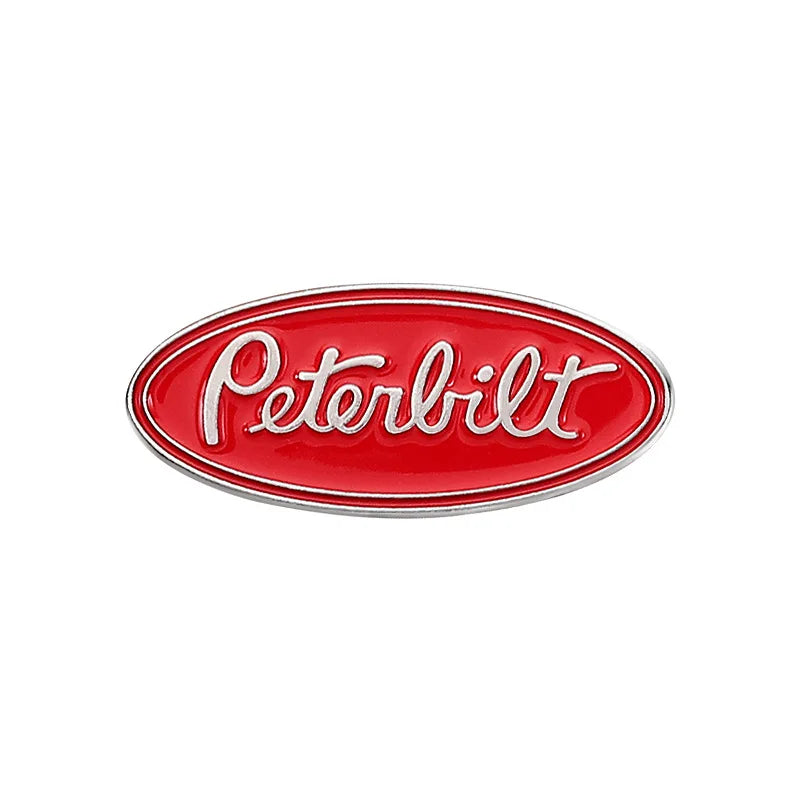 A red enamel lapel pin with the word Pertbilt in white lettering.