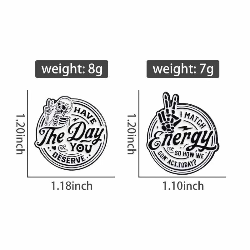 Two enamel lapel brooches, one weighing 8g and the other 7g, featuring a skull design and a match energy design.