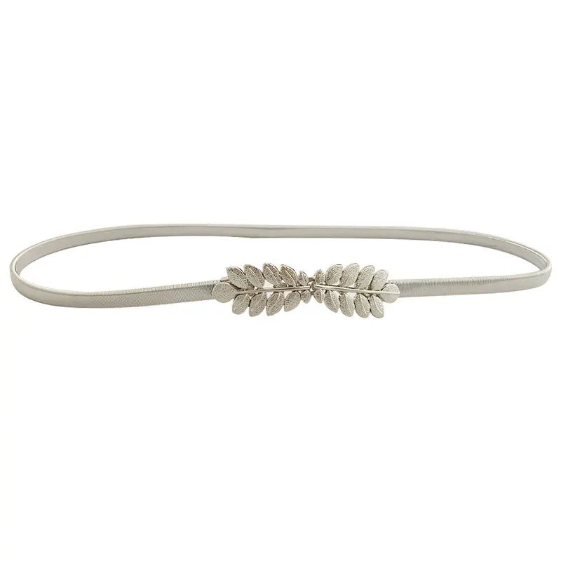 A thin, stretchable gold chain waist belt for women with a leaf-like embellishment.