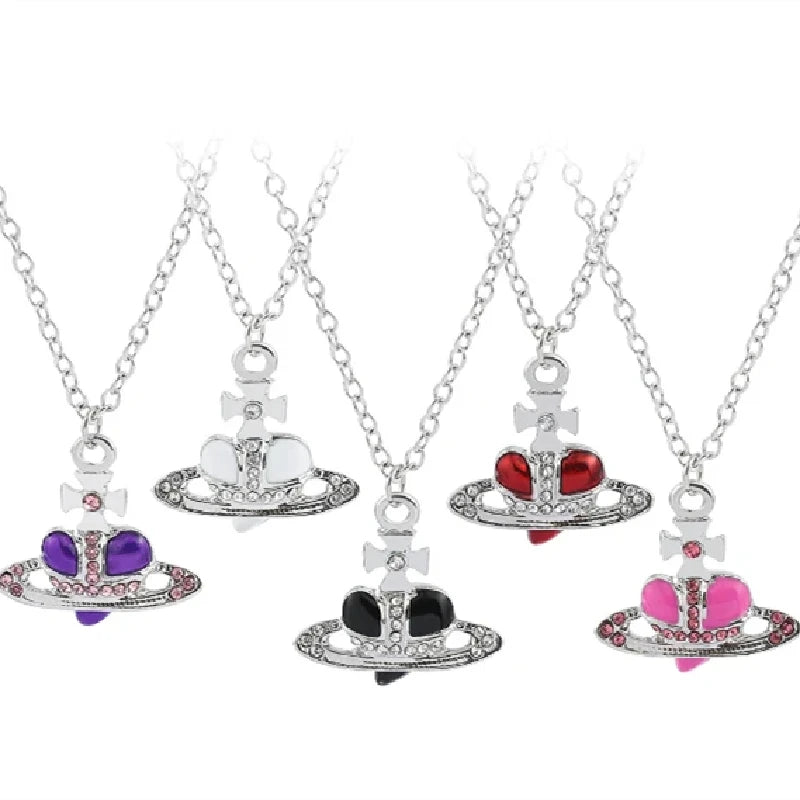 Set Vintage Saturn-Anhänger mit Diamant- und farbigen Edelstein-Inlays.