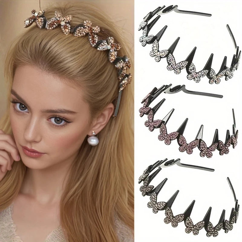 A close-up of a woman wearing a gold and rose gold rhinestone butterfly hair accessory.