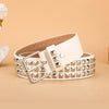 A beige leather belt featuring silver metal rivets and a white rectangular buckle.