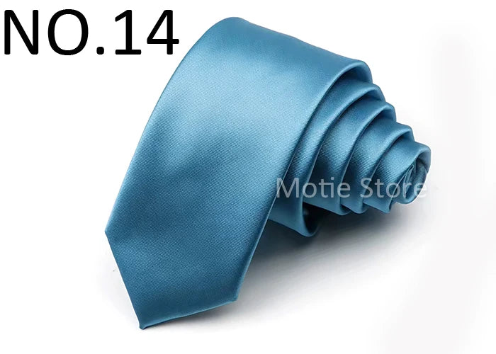 A folded blue satin neck tie shown against a white background.