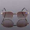 A pair of brown-tinted sunglasses with gold-toned frames and plus 300 protection.