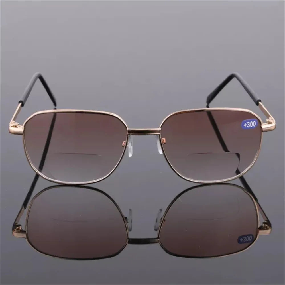 A pair of brown-tinted sunglasses with gold-toned frames and plus 300 protection.