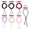 A collection of nine satin hair ties in various colors including black coffee red purple beige pink and a black elastic band