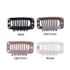 Four hair extension snap clips in black, dark brown, light brown, and blonde colors.