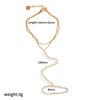 A delicate gold-plated stainless steel bracelet with a chain and a small charm.