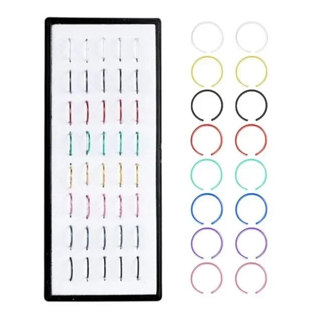 A set of fashion crystal stainless steel nose stud piercing jewelry in various sizes and colors.