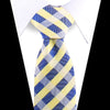 A yellow and blue striped silk necktie tied in a knot against a white shirt.