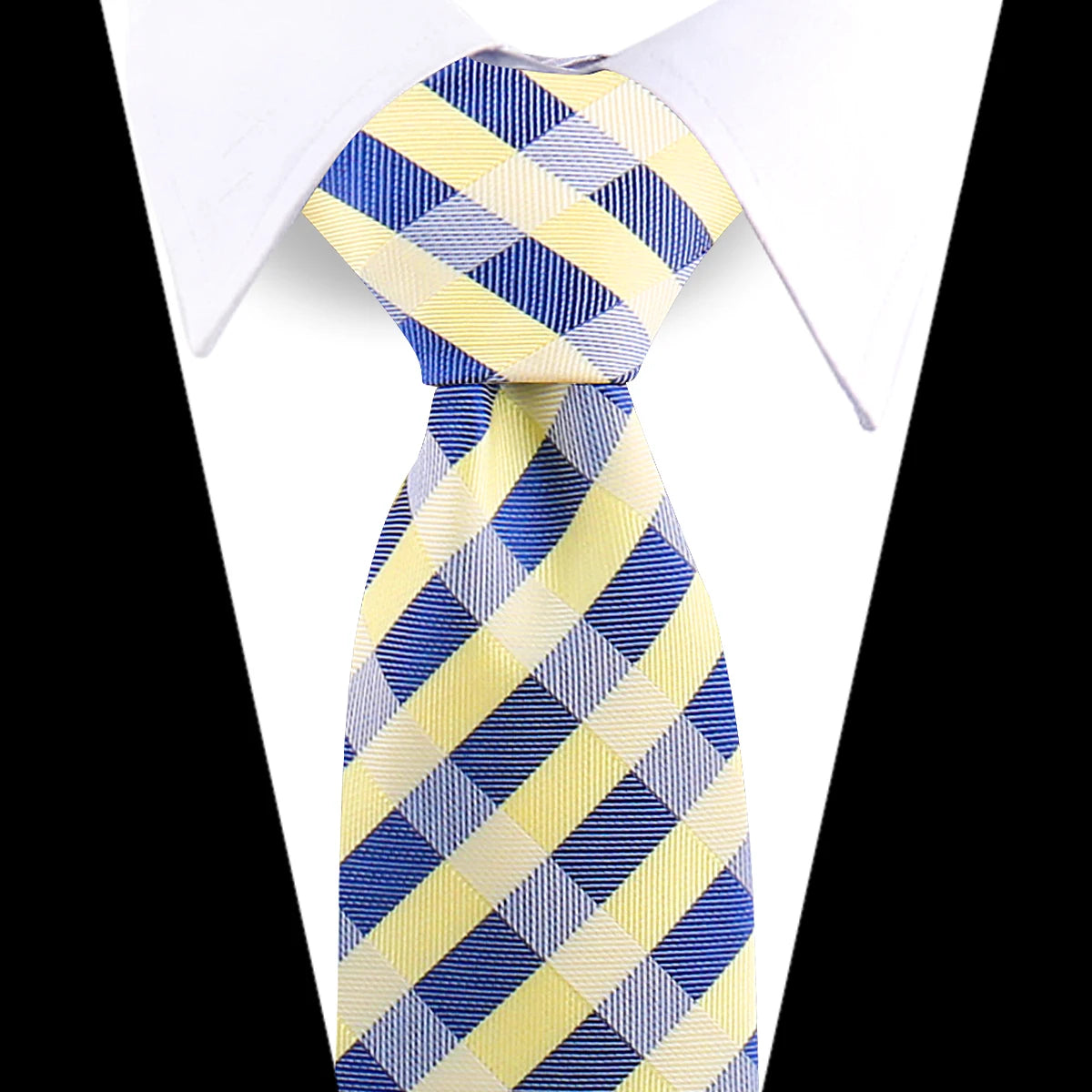 A yellow and blue striped silk necktie tied in a knot against a white shirt.