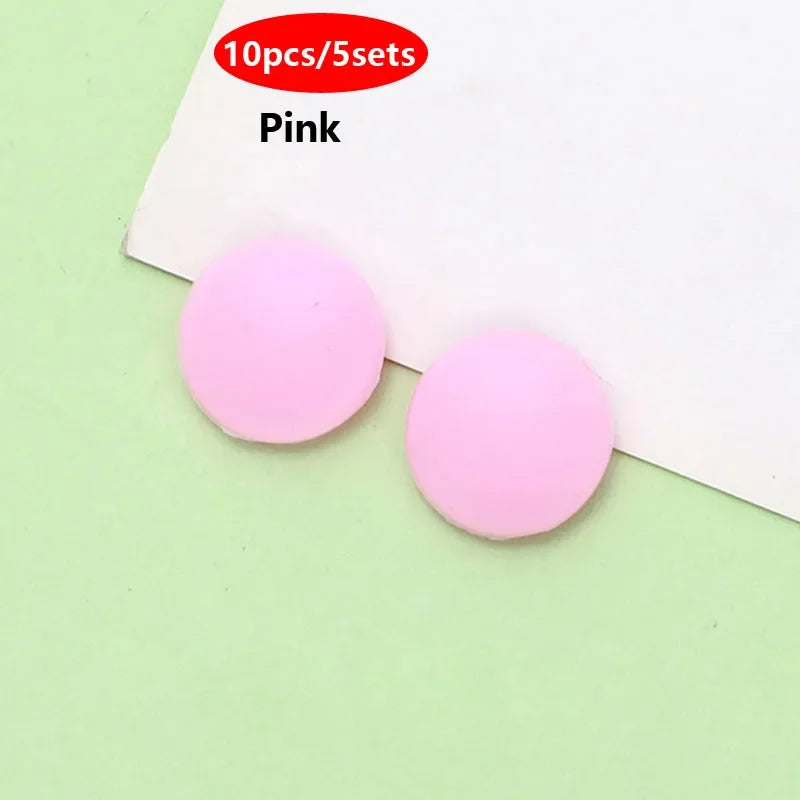 Pink silicone eyeglass grips for anti-slip comfort shown on a white background.