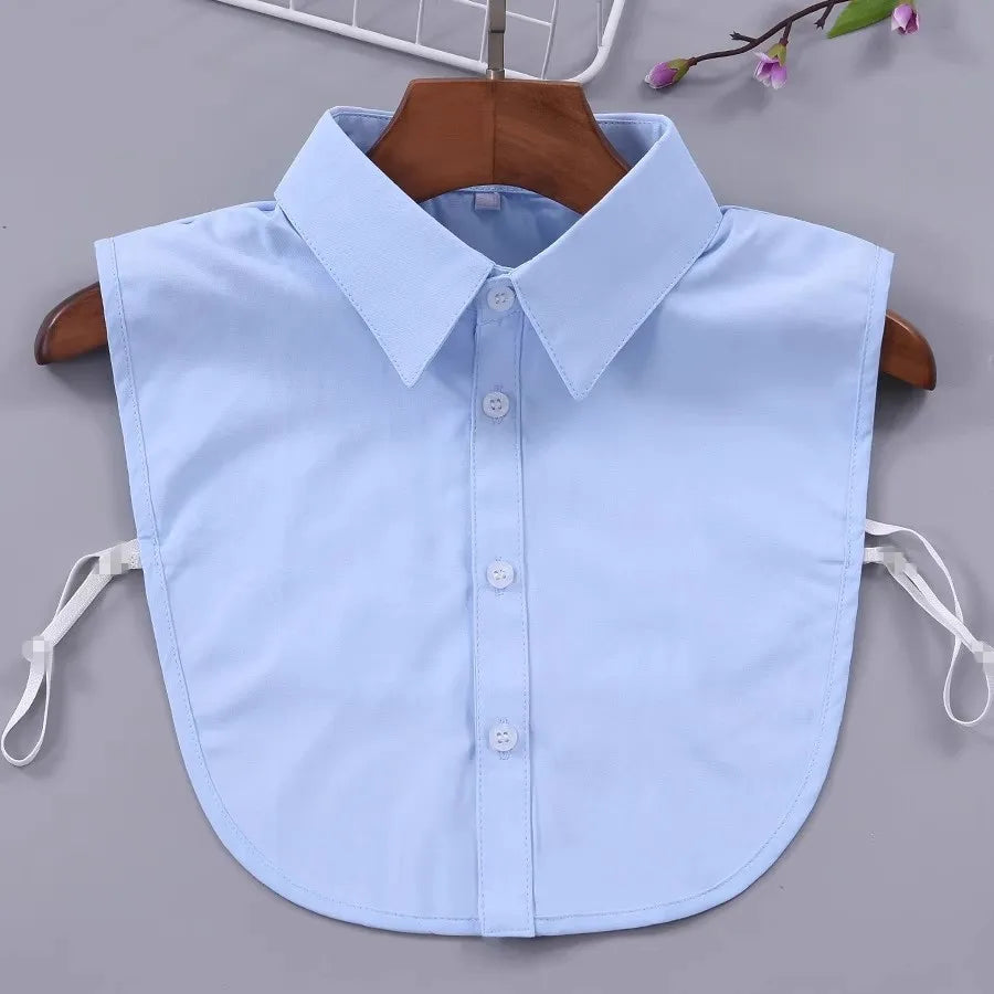 Light blue detachable button-up collar shirt displayed on a wooden hanger.