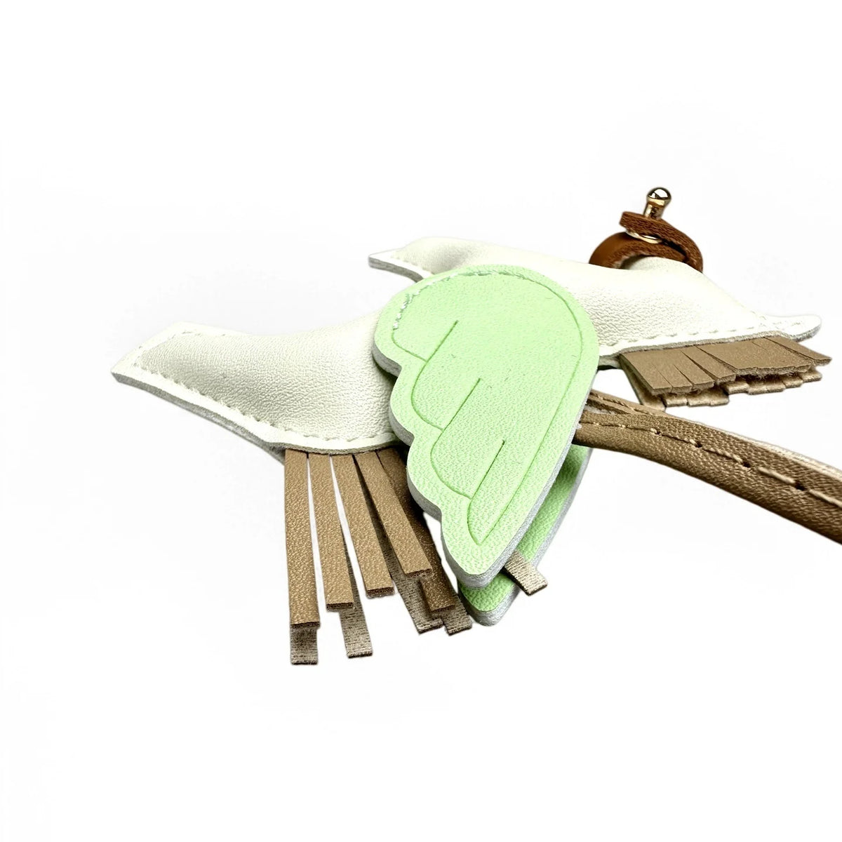 A light beige and lime green elegant winged pony keychain featuring suede leather wings and a leather strap.