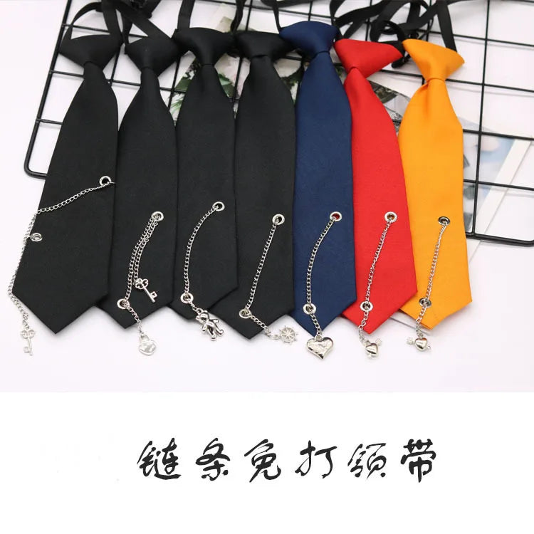 A set of pre-tied chain neckties in black, navy blue, red, and orange are displayed on a wire rack.