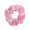 Pink satin scrunchie tied in a voluminous, ruffled style