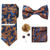 A navy blue men's formal tie and accessory set featuring an orange floral pattern, including a bow tie and pocket square.