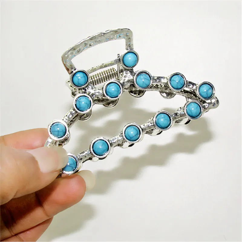 Silver metal hair claw clips decorated with light blue turquoise beads