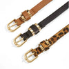 A set of three slim PU leather belts in brown, black, and leopard print with gold vintage buckles.