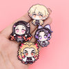 A hand holds a set of eight cute enamel cartoon brooches featuring various anime-style characters with pink and purple hair.