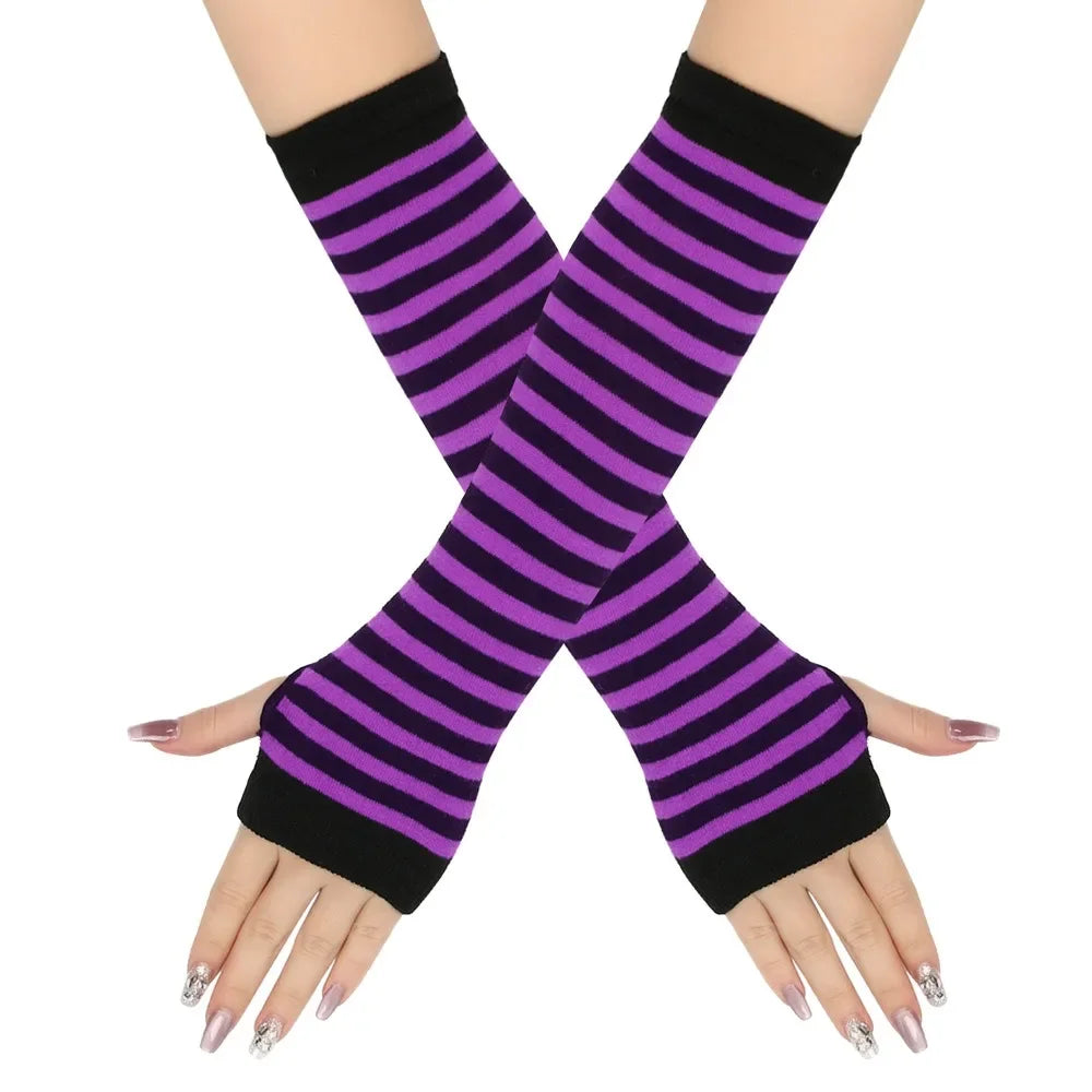 A pair of purple and black striped knitted fingerless gloves worn on a hand.