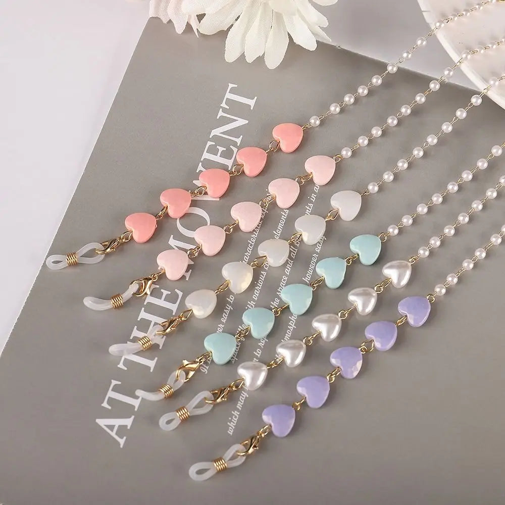 Multiple strands of fashion pearl beaded eyewear chains featuring pink, white, and blue colored beads