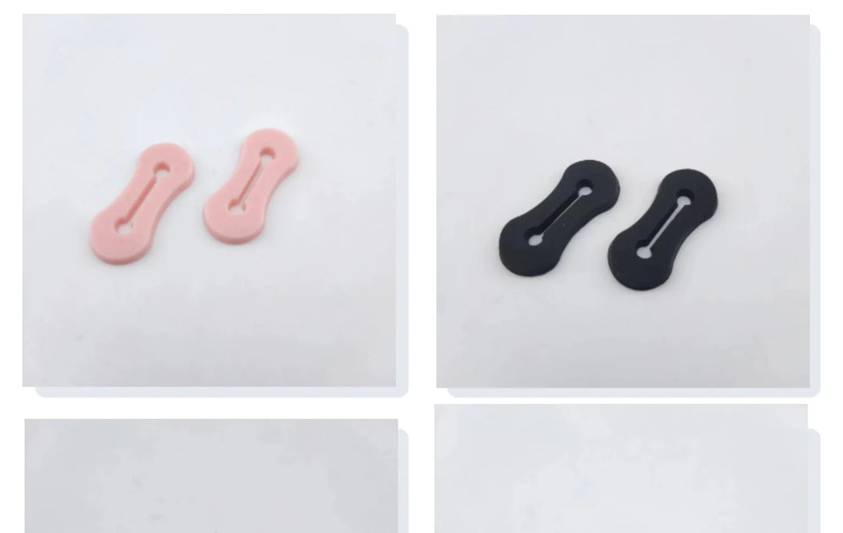 Dos correas ajustables de manga de rosa y negras sobre un fondo blanco.